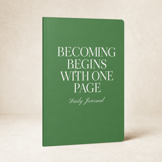 Green Becoming Begins with One Page daily journal on a warm ivory background
