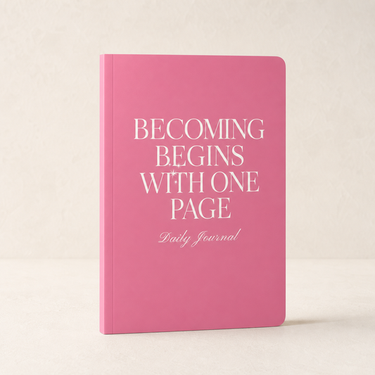 Pink Becoming Begins with One Page daily journal on a warm ivory background