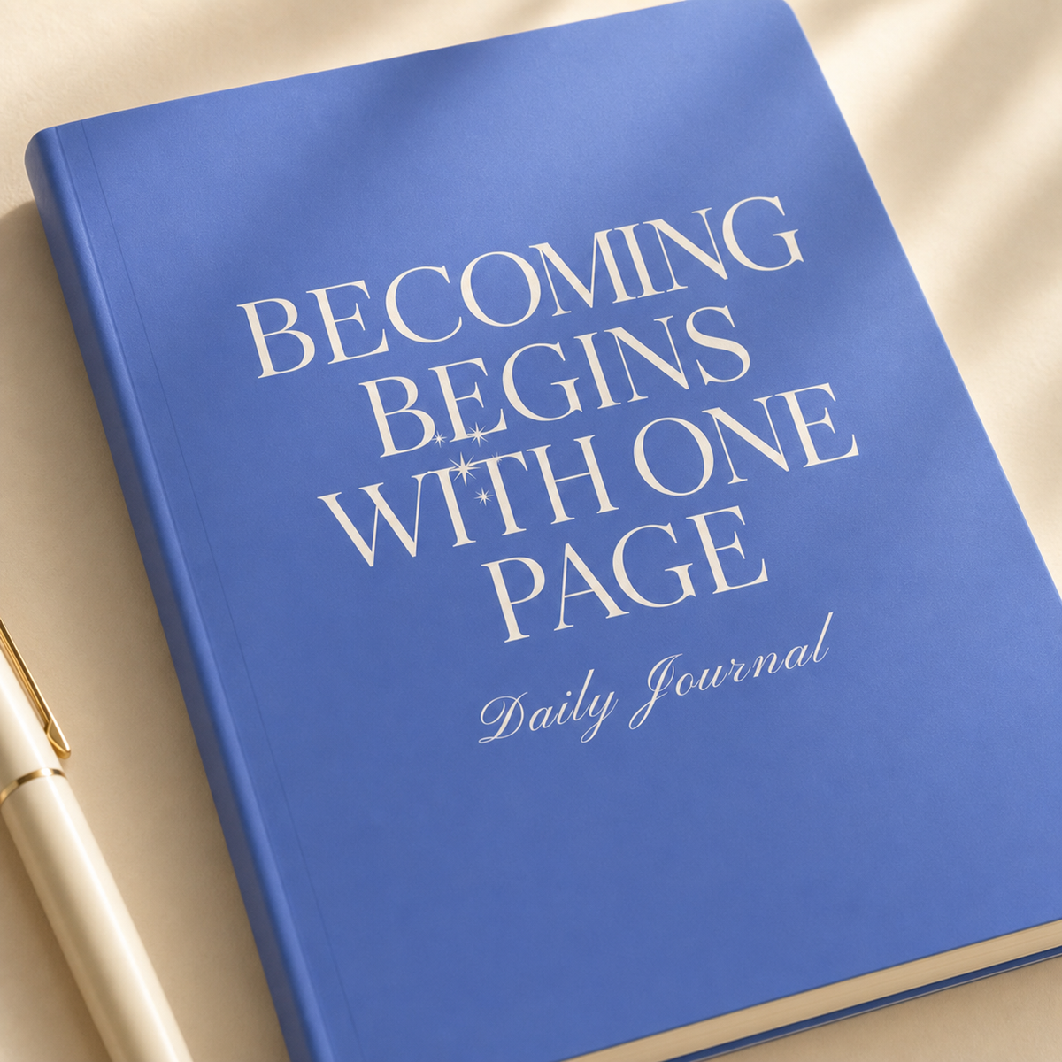 Close-up of the blue journal satin cover, rounded corner, and cream typography