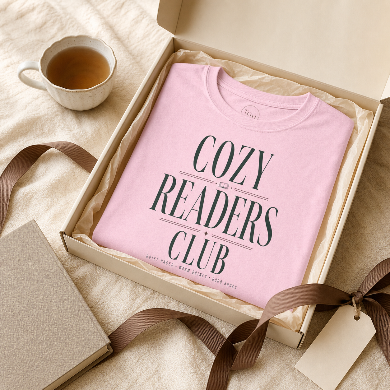 Light Pink Cozy Readers Club tee presented as a book lover gift
